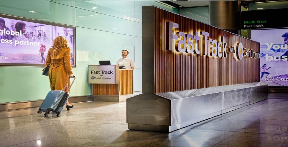 fast_track_large woman at fast track desk