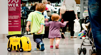 Child and baby with suitcase