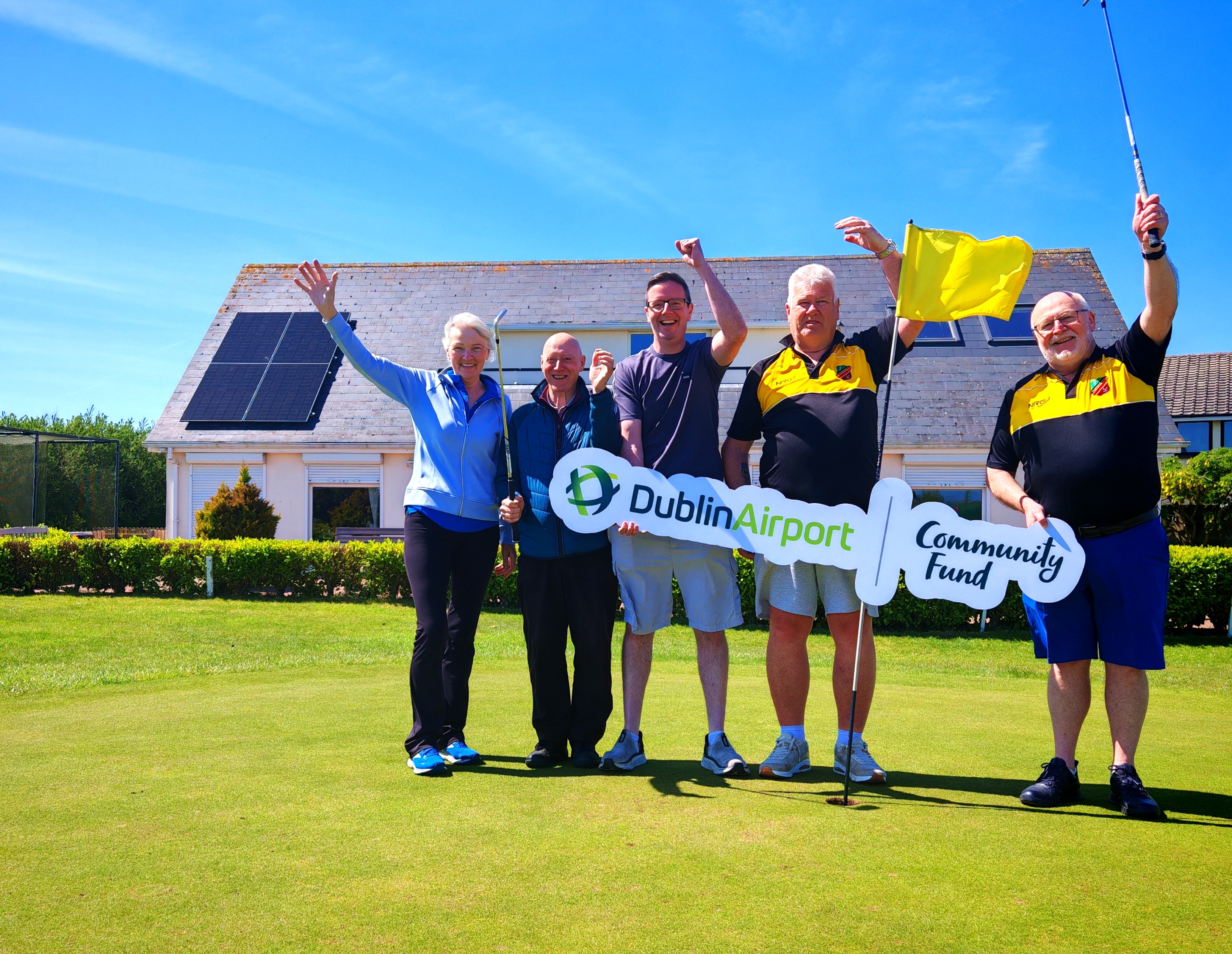 IMG_20250506_134311 Portmarnock Pitch and Putt Club members with Dublin Airport Community Fund sign