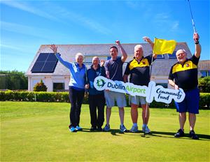 Portmarnock Pitch and Putt Club members with Dublin Airport Community Fund sign