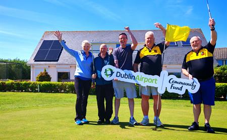 Portmarnock Pitch and Putt Club members with Dublin Airport Community Fund sign