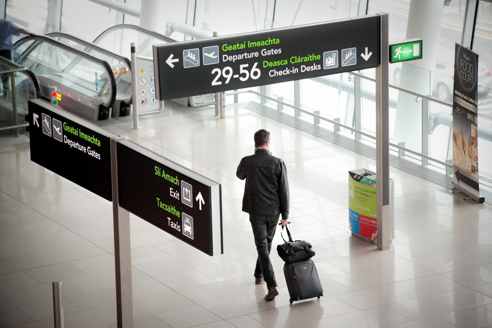 Man-Beneath-Signs-975x650 Man-Beneath-Signs-975x650
