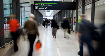 passengers walking through Dublin Airport passengers walking through Dublin Airport