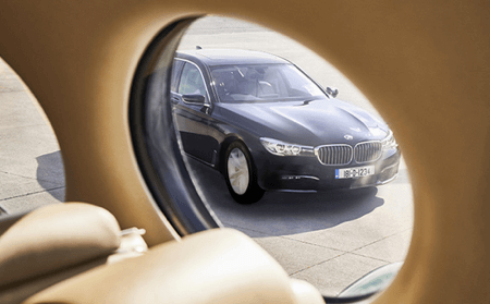 platinum arrival BMW park beside plane